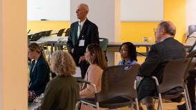 group of people practicing mindfulness in a classroom